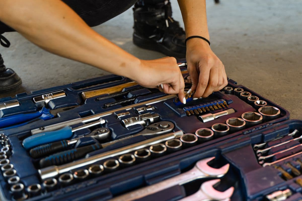 A selection of hand tools organized inside a toolbox