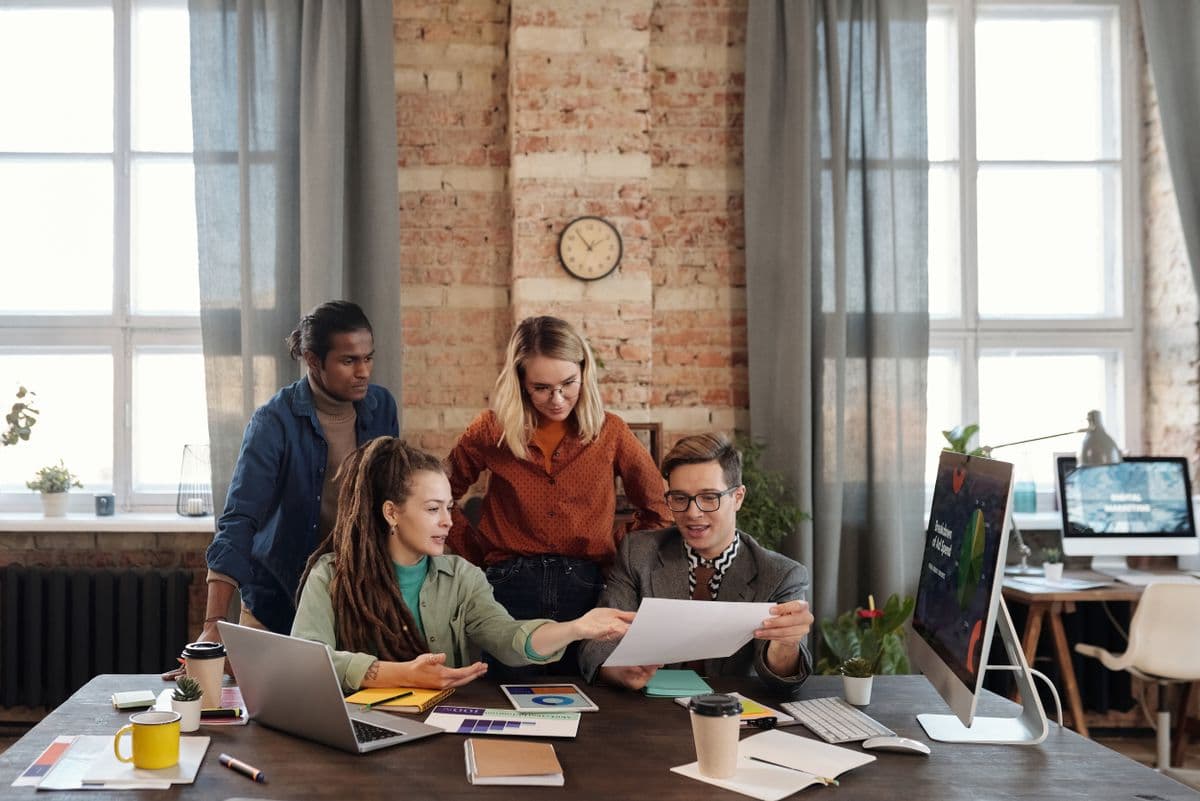 Colleagues discussing a marketing plan in an office