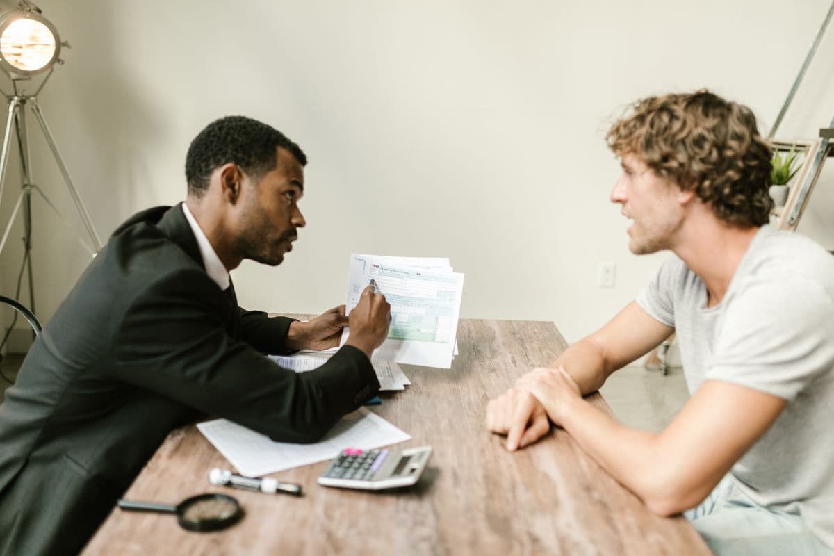 An advisor and client reviewing paperwork together